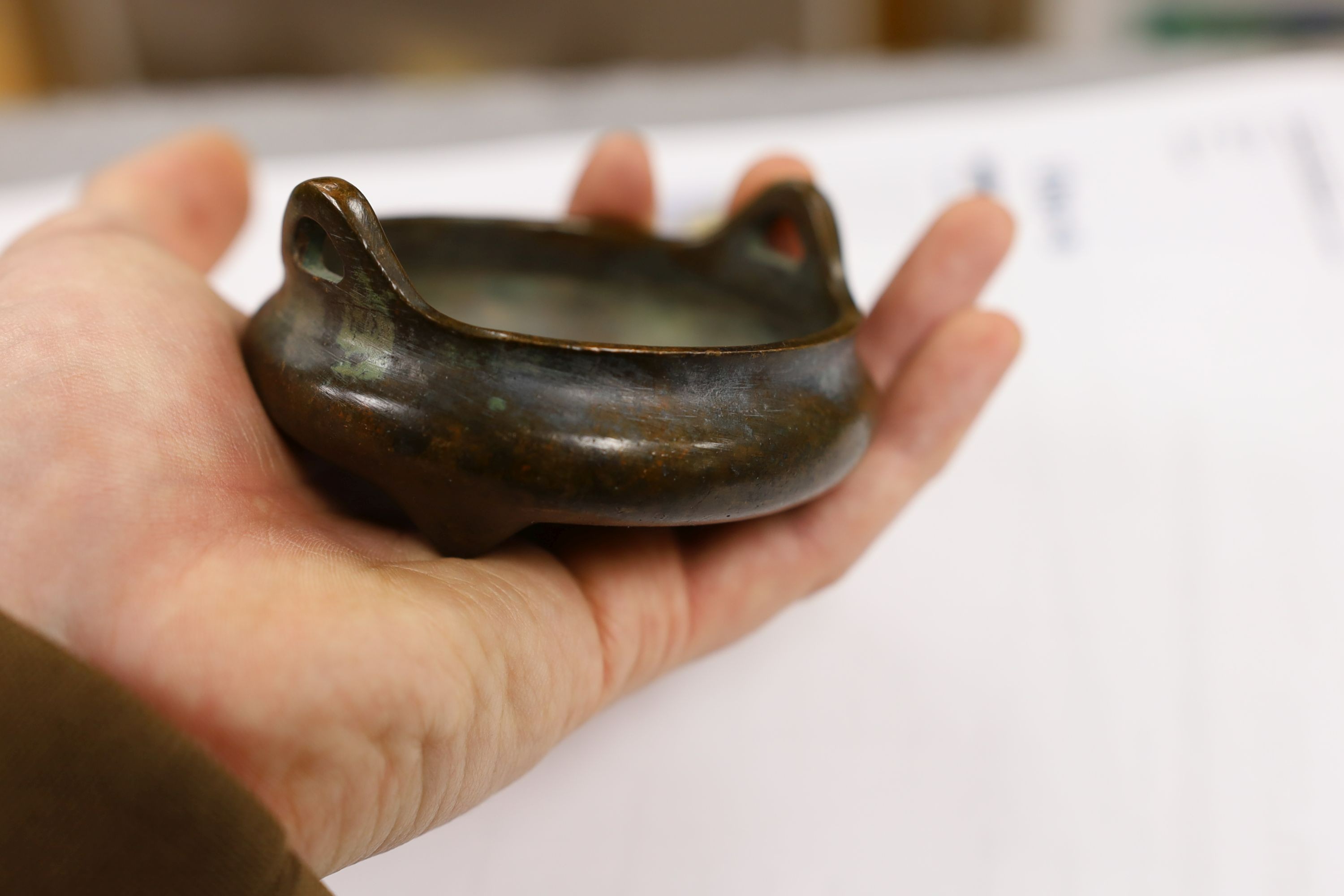Two Chinese bronze censers, largest 11cms diameter